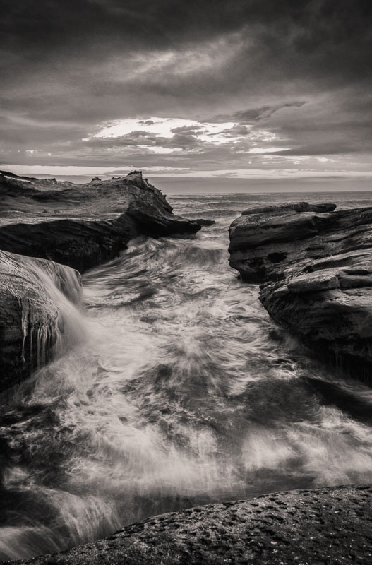 Sculpted Water. Cape Kiwanda. A lively channel through the sandstone in the evening.