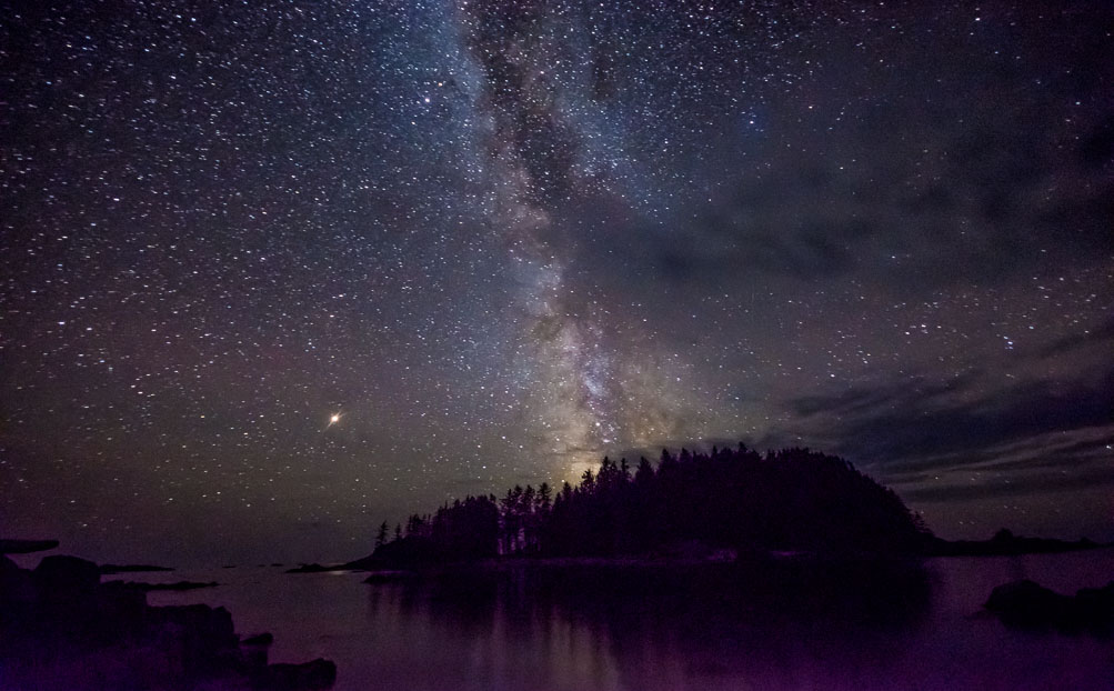 Central Milky Way plunging into the Pacific, attended by the Red Planet, Mars.